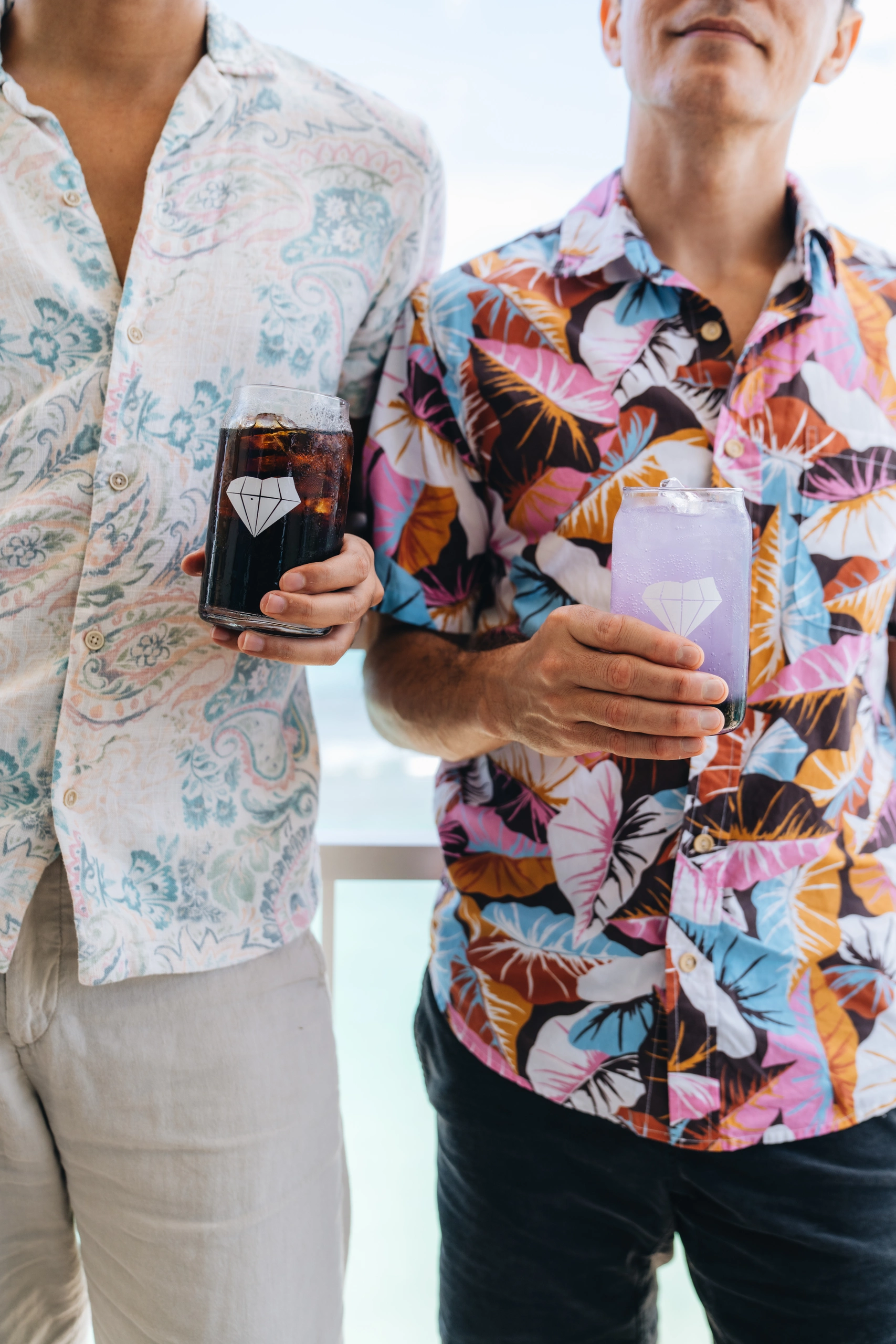 A couple holding drinks